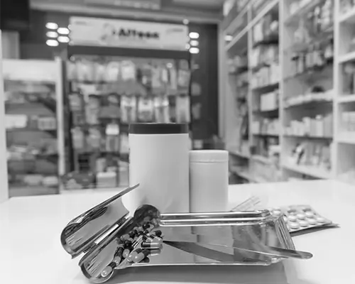 Medication and pill bottles on pharmacy counter representing Medi-Cal Regulation Specialists assisting with prescription access and healthcare planning