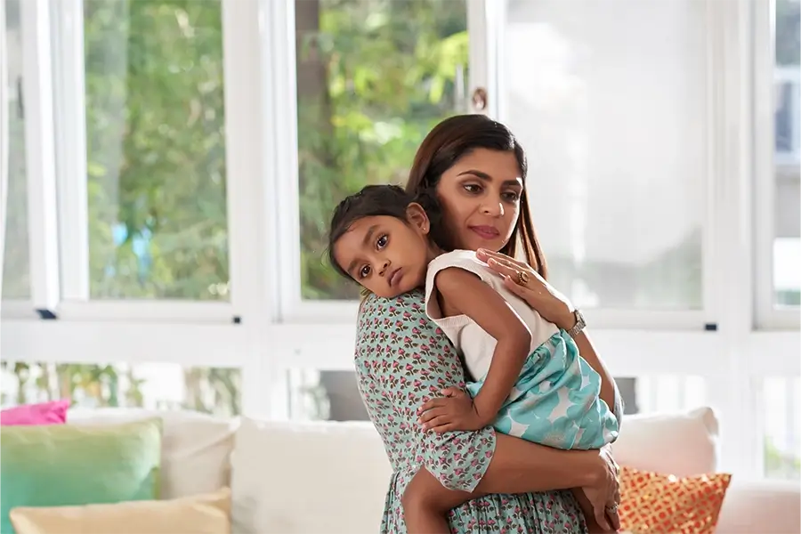 Mother holding her young child in a comforting embrace, representing Medi-Cal services for non-seniors, including healthcare support for families, low-income individuals, and those in need of medical assistance in California.