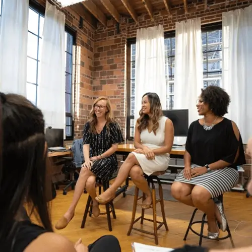 Group of professionals leading a discussion in a seminar setting, representing educational workshops about Medi-Cal, covering eligibility, application processes, and healthcare benefits for California residents.